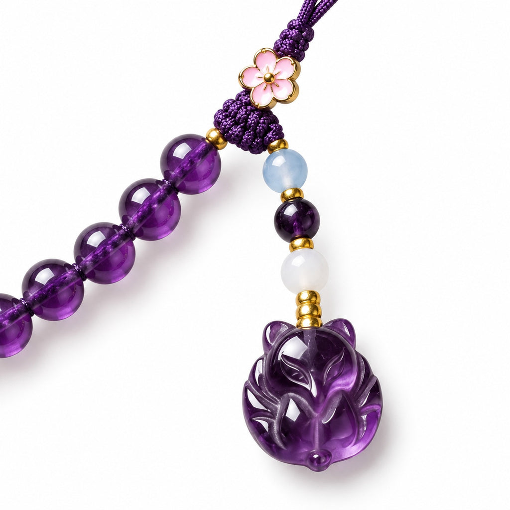 Purple glass cat carving and bead connector detail