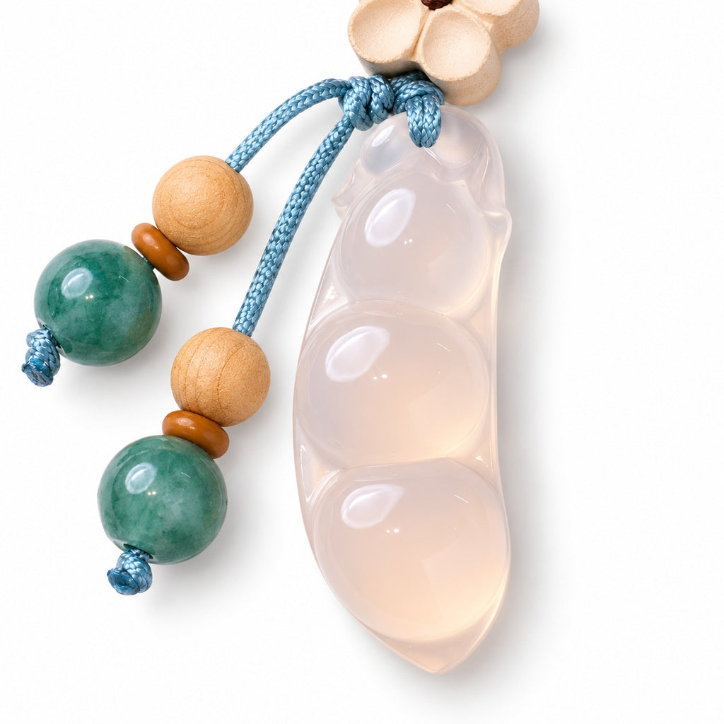 Pale bean pod and flower bag charm — pod detail