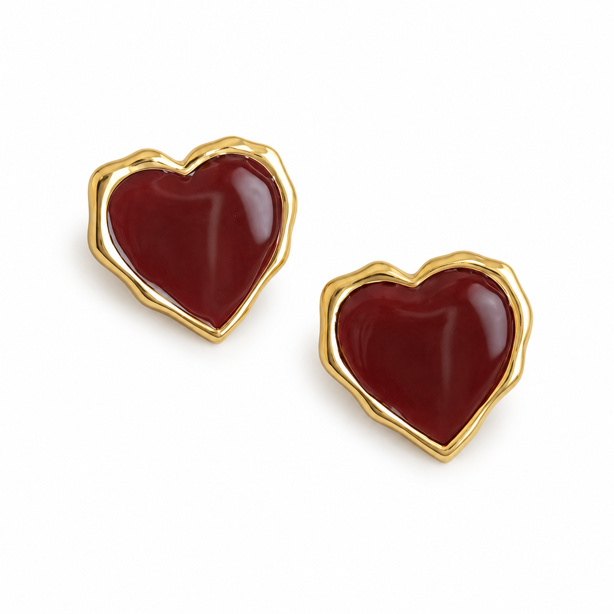 Burgundy Heart Gold-Tone Stud Earrings — angled pair on white