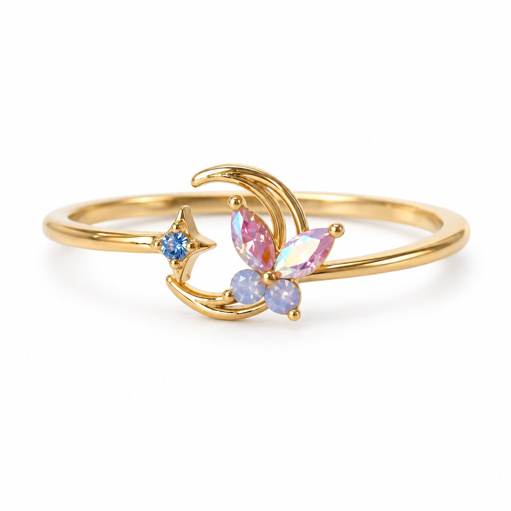 Crescent butterfly gold-tone adjustable ring with pink and blue accents — left view
