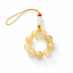 Golden bead loop phone charm — angle