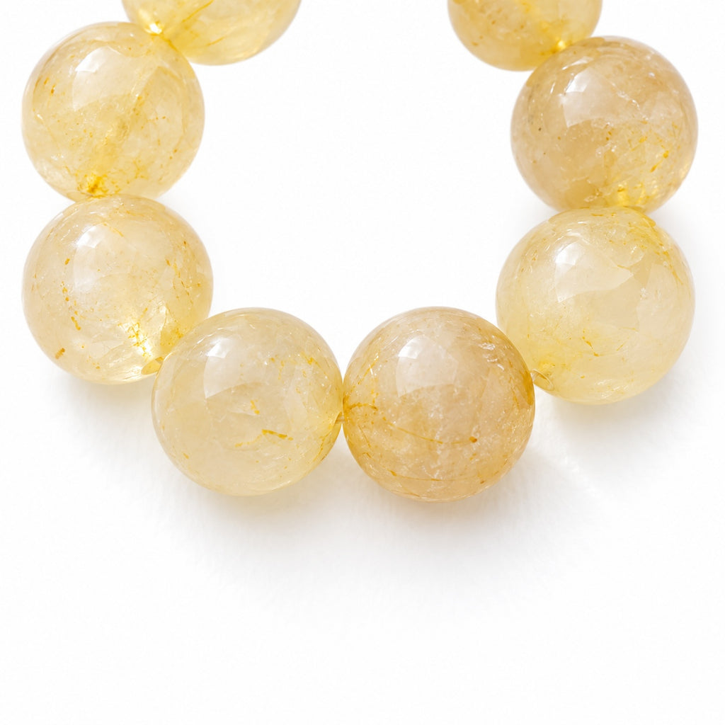 Golden bead loop phone charm — bead detail
