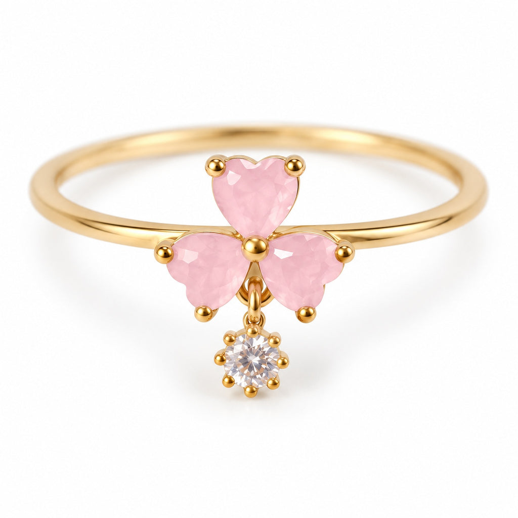 Pink three-petal gold-tone adjustable ring with a clear round drop — detail view
