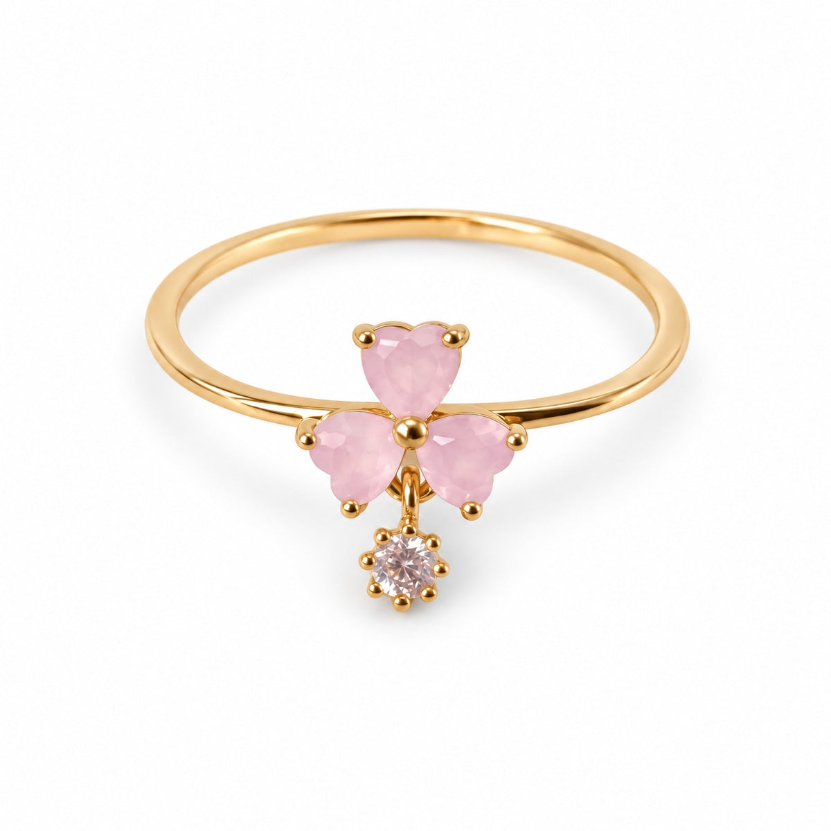 Pink three-petal gold-tone adjustable ring with a clear round drop — elevated view