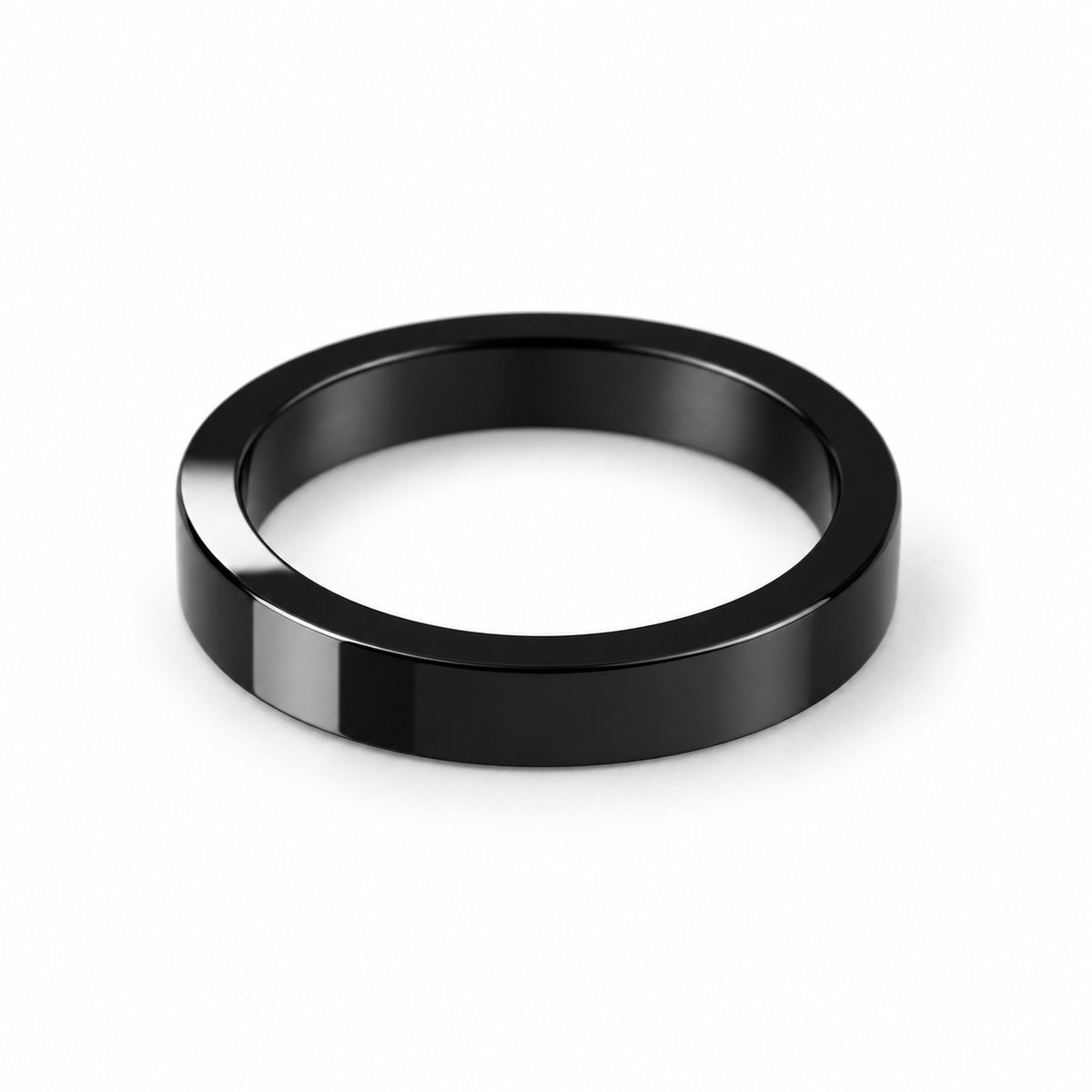 Polished black flat band ring — angle