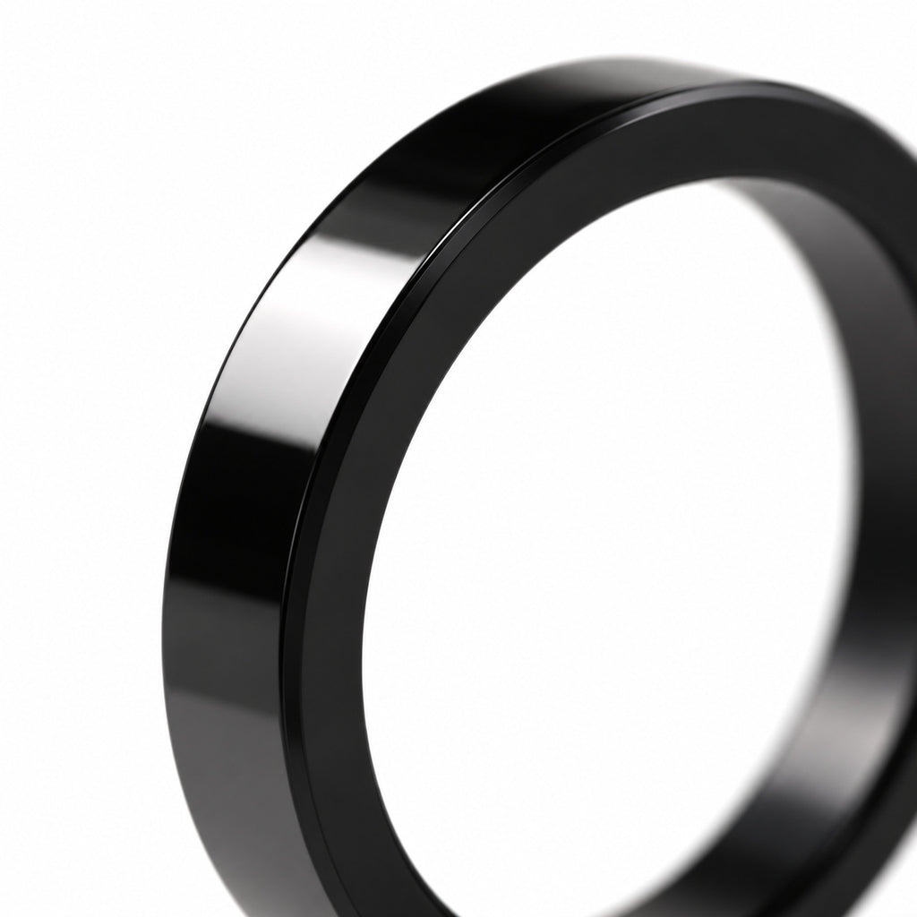 Polished black flat band ring — edge detail