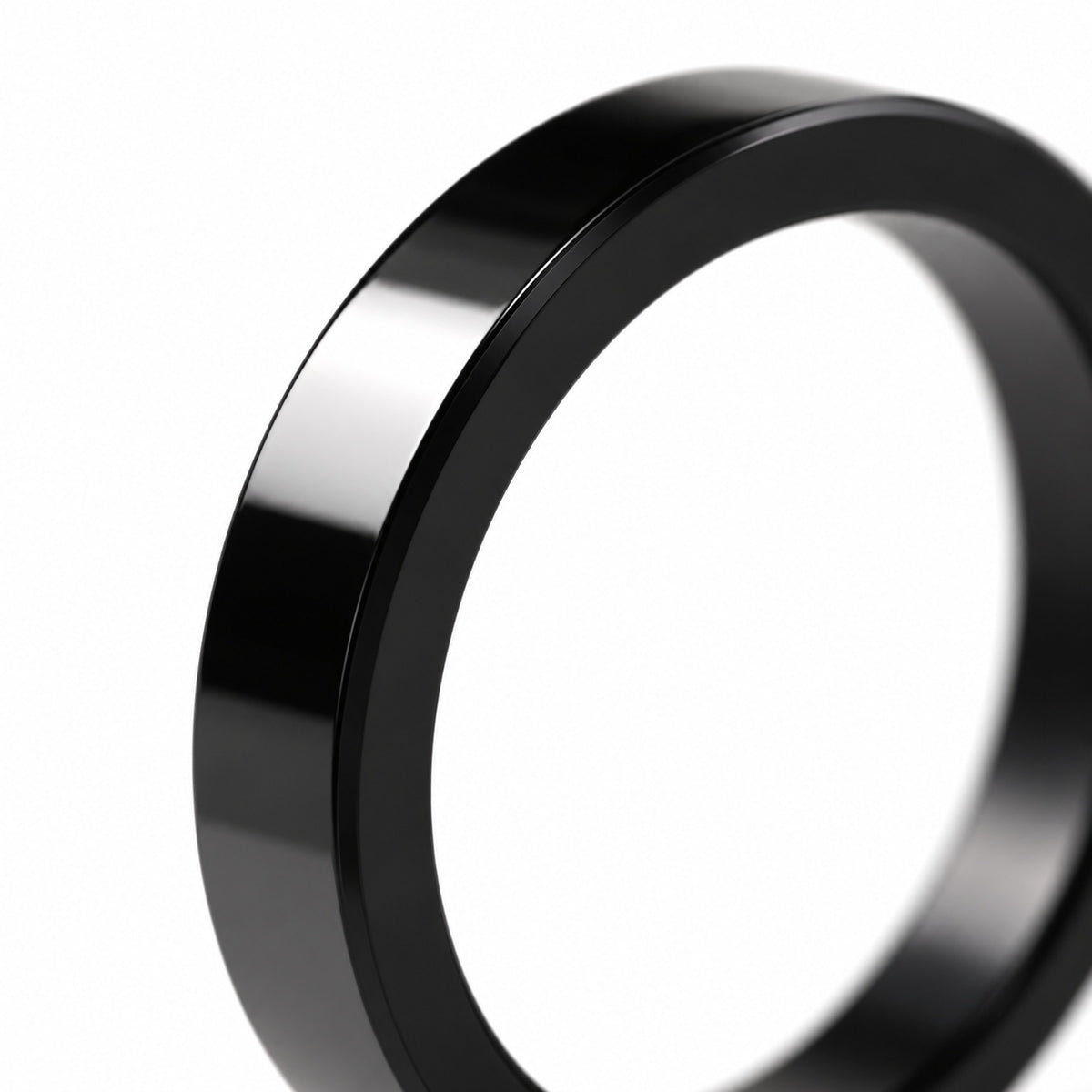 Polished black flat band ring — edge detail
