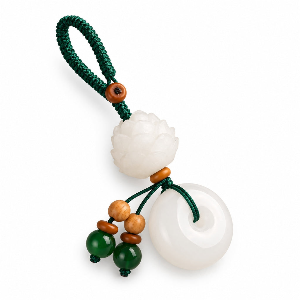 White lotus and round disc bag charm — angle