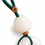 White lotus and round disc bag charm — lotus detail