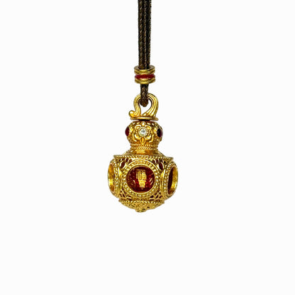 A front view of an authentic sand gold 3D Hulu gourd pendant featuring an openwork filigree sphere base and a red enamel core on a white background.