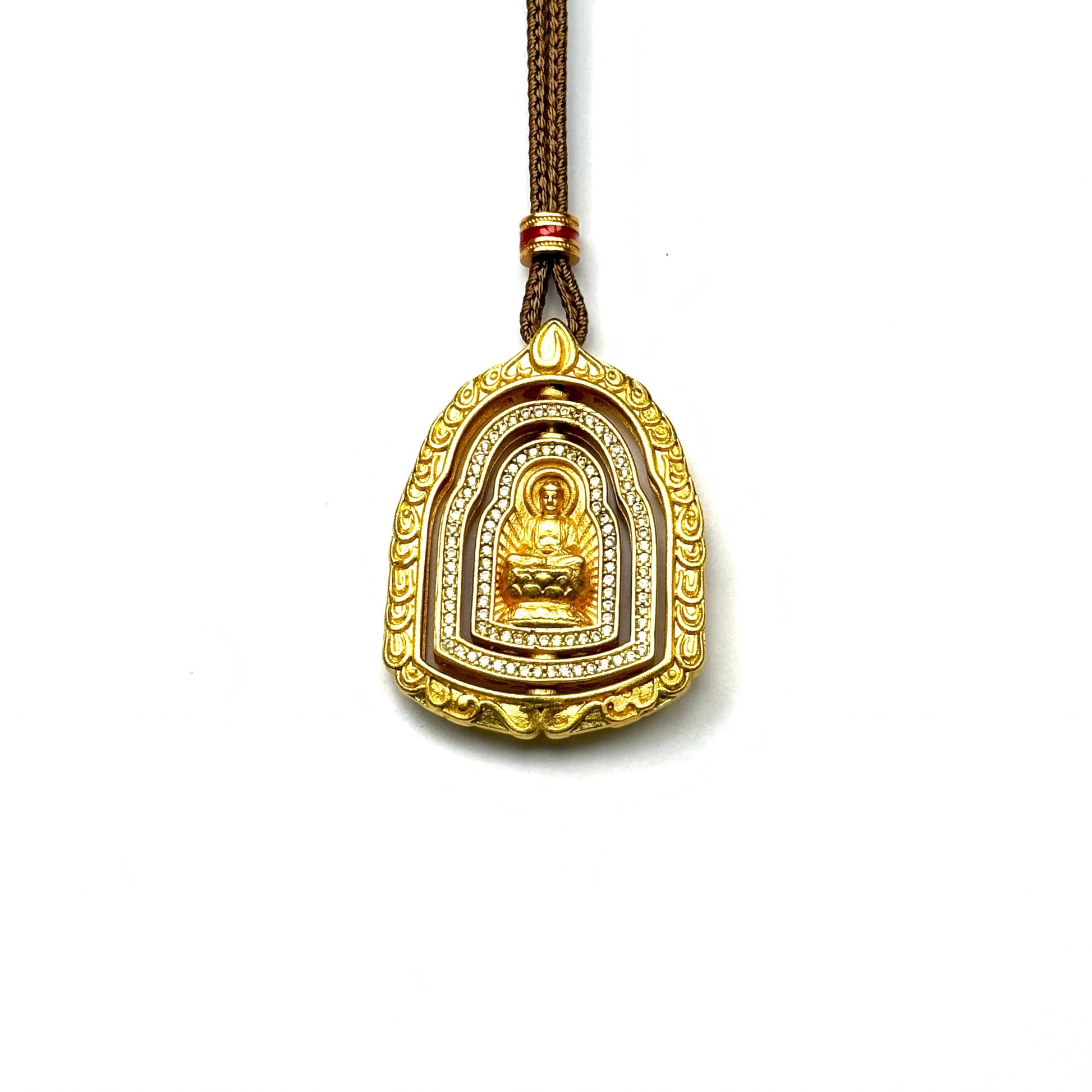 A front view of an authentic sand gold 3d spinning Buddha pendant featuring a multi-layer rotating shrine and micro-pave rhinestone crystals on a white background.