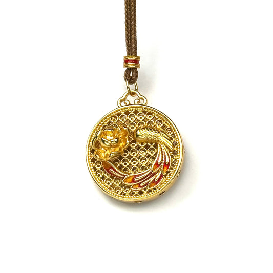 A front view of an authentic sand gold 3D Hulu gourd pendant featuring an openwork filigree sphere base and a red enamel core on a white background.