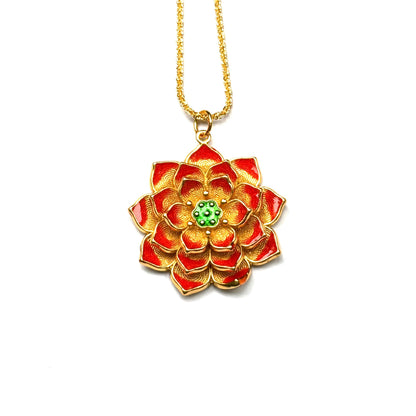 A front view of an authentic sand gold multi-layer lotus pendant featuring vibrant red enamel petals and a green center on a gold chain, against a white background.