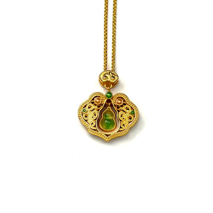 front view of an elegant sand gold Ruyi lock pendant featuring intricate openwork and a dangling green stone Hulu gourd in the center, on a white background.