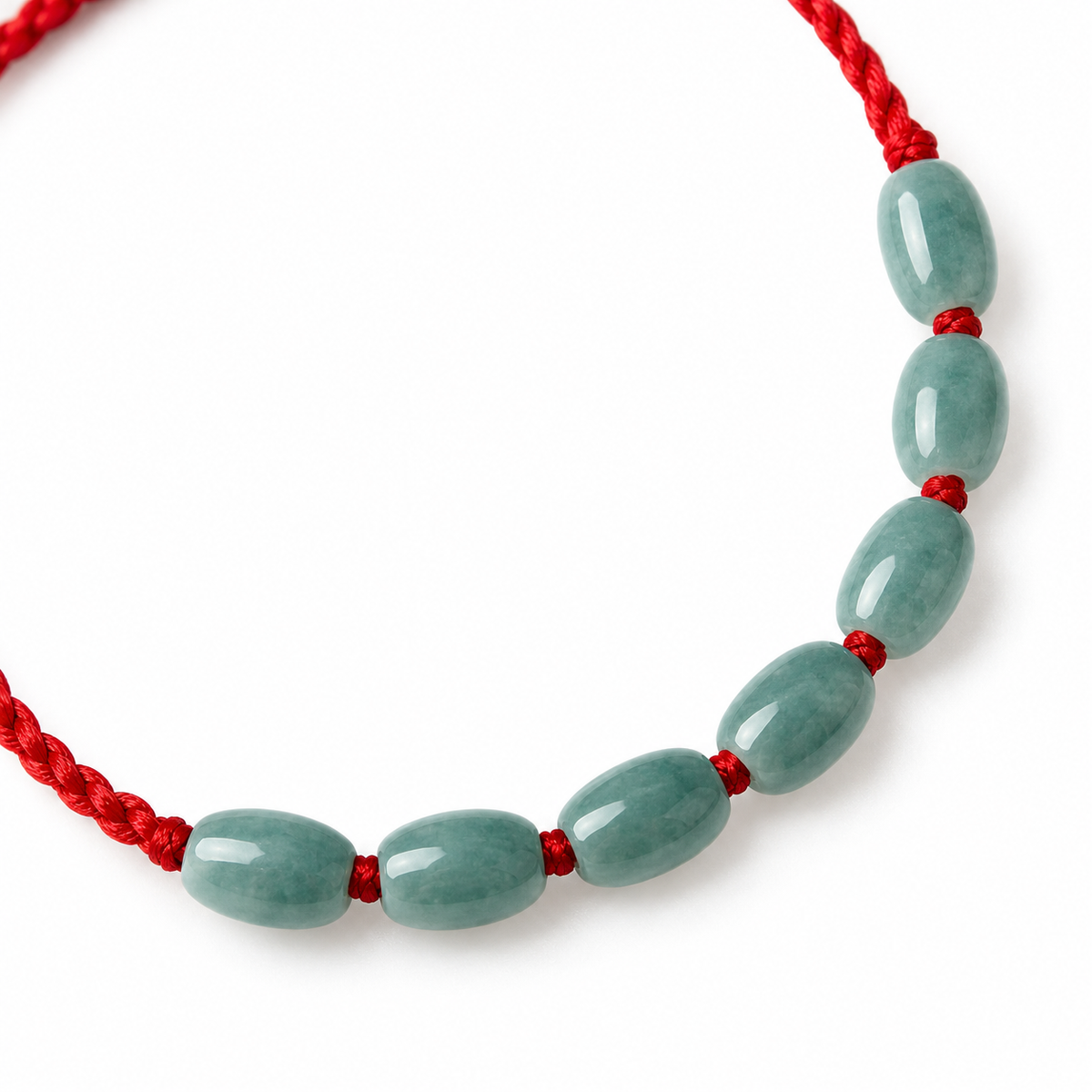 Seven Oval Bead Red Cord Bracelet - centerpiece detail on white
