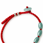 Seven Oval Bead Red Cord Bracelet - cord and bead detail on white