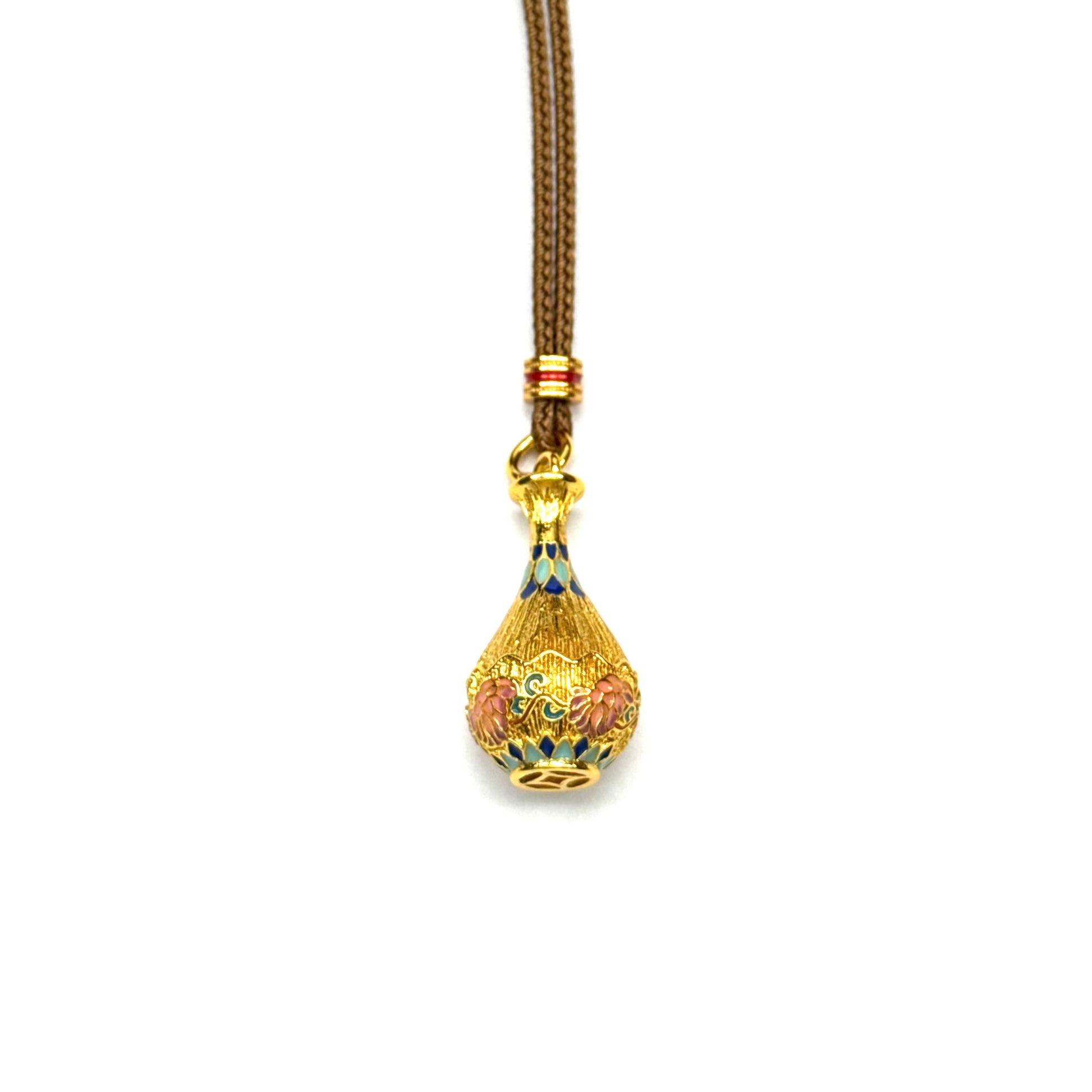 An authentic sand gold bottle pendant necklace attached to a traditional brown braided cord with red accents, showcasing the beautiful cloisonne enamel details on a white backdrop.
