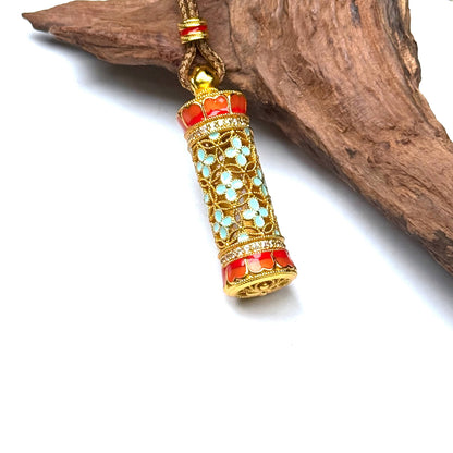 A traditional sand gold folding fan fortune amulet resting on rustic driftwood, highlighting its warm golden metallic luster and elegant Zen aesthetic.