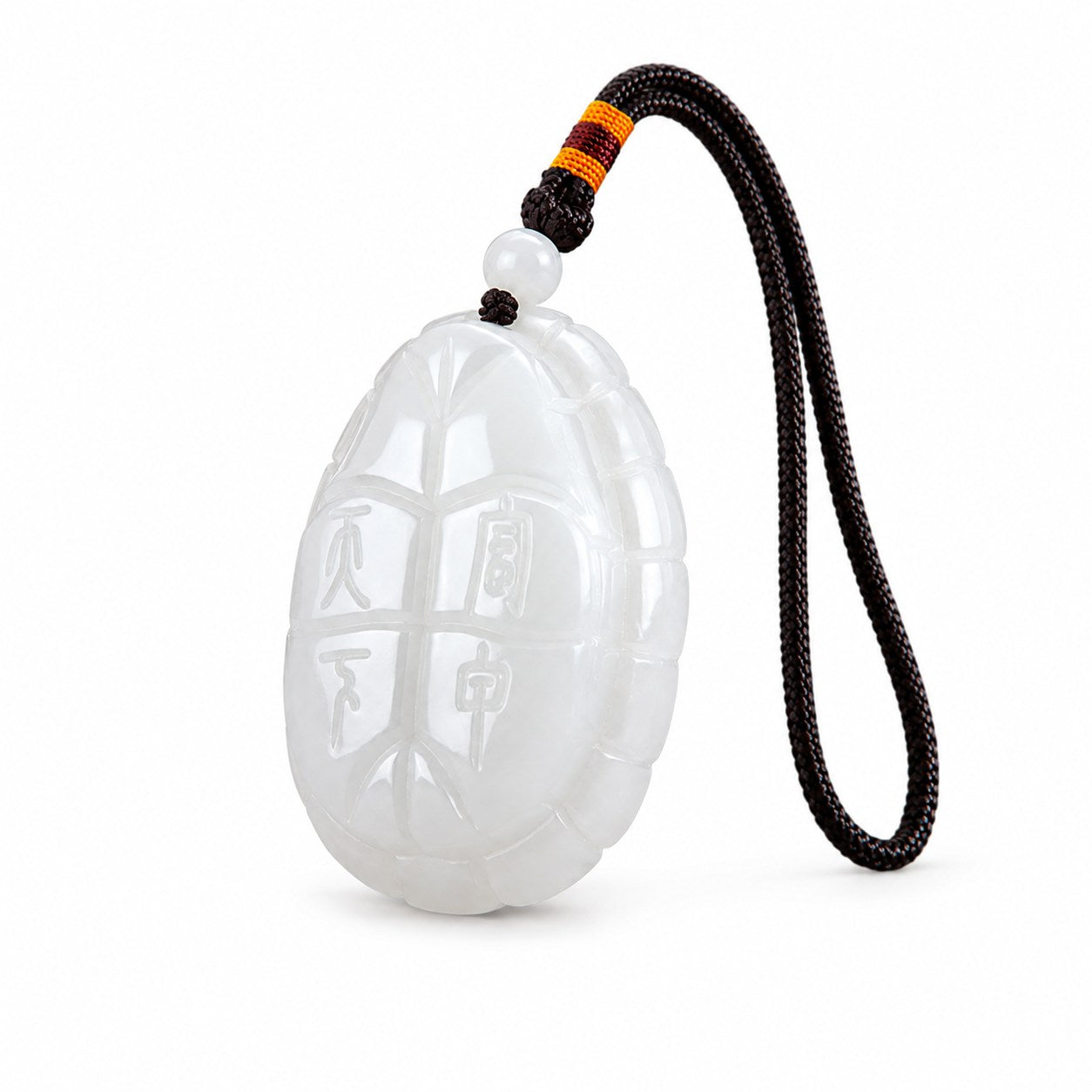 Angled reverse view of white jade turtle amulet showing the Fu Jia Tian Xia carving