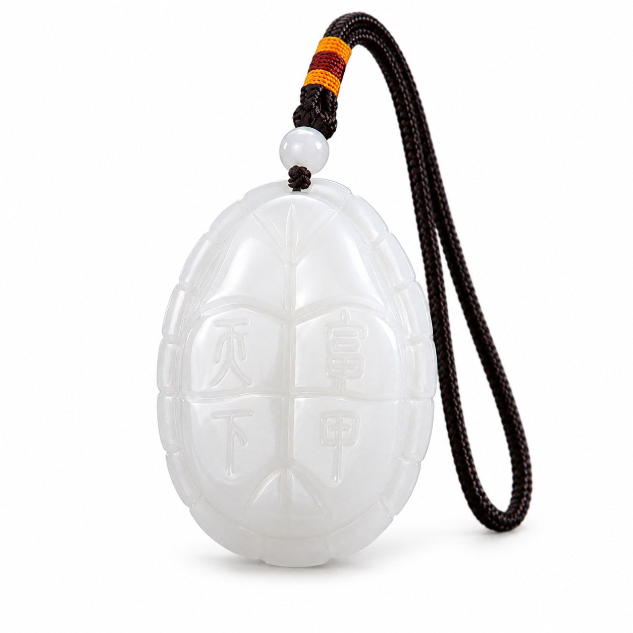 Reverse view of white jade turtle amulet carved with the Chinese characters Fu Jia Tian Xia