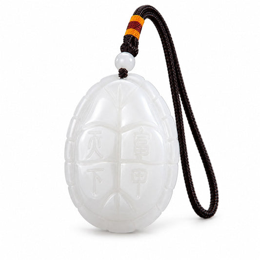 Reverse view of white jade turtle amulet carved with the Chinese characters Fu Jia Tian Xia