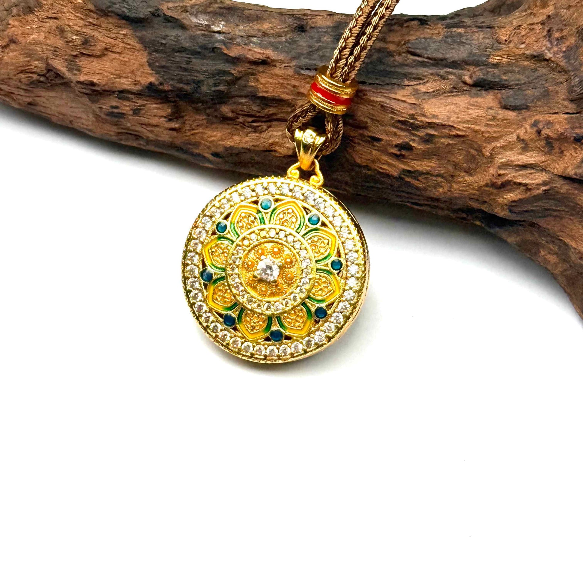 A regal sand gold hollow prayer gourd amulet resting gracefully on natural rustic driftwood background for a serene Zen aesthetic.