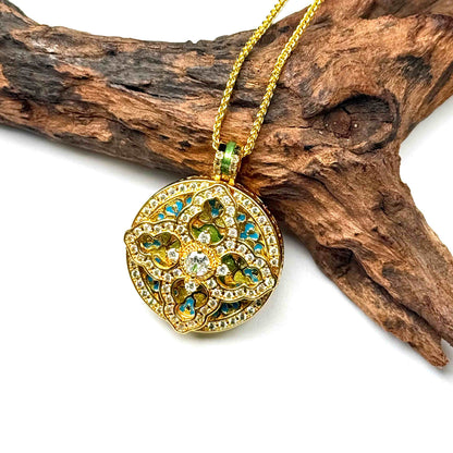 Macro close-up shot of a luxurious gold pavé diamond mandala charm on wood, capturing the precise metal layering, side thickness, and reflective quality of the crystals.